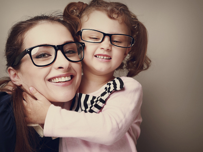 woman smiling with young girl
