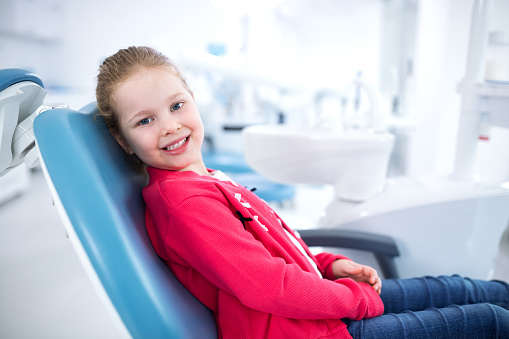 girl smiling in dental chair